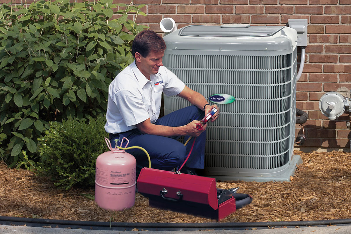 AC installation tech checks gauges in Pickerington